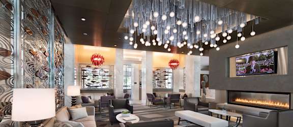 a living room filled with furniture and a fire place at The Pearl, Silver Spring, MD