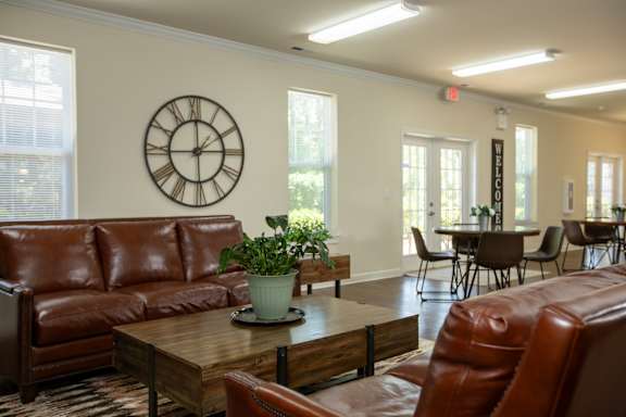 A home gym with treadmills and elliptical machines.