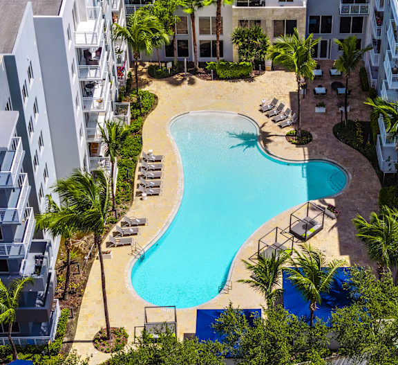 The Manor Resort Style Pool with Chaise Lounge Seating