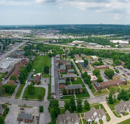 an aerial view of a suburban neighborhood with houses and trees