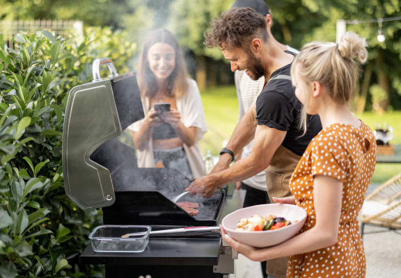 People Grilling Outside