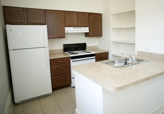 a kitchen with a sink and a refrigerator