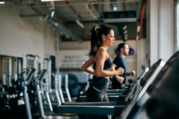 a woman running on a treadmill at the gym at Legacy at Cibolo, Boerne, TX, 78006