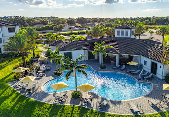 A large house with a pool in the backyard.
