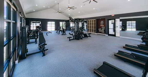 Fitness center with cardio and weight equipment at Northwoods, Texas