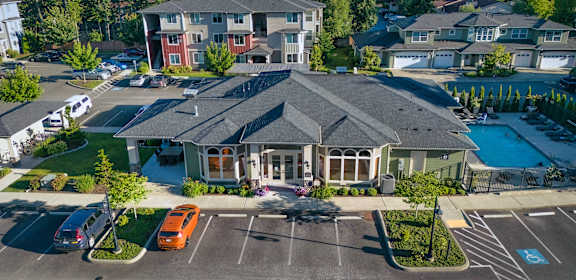 an aerial view of a large house in a parking lot