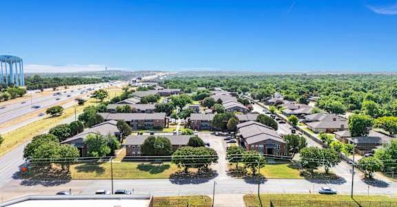 an aerial view of a neighborhood with houses and trees