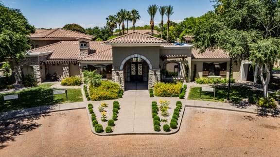 the front yard of a house with a driveway and plants