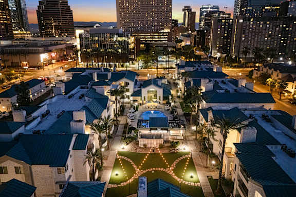 an aerial view of a swimming pool in an apartment complex