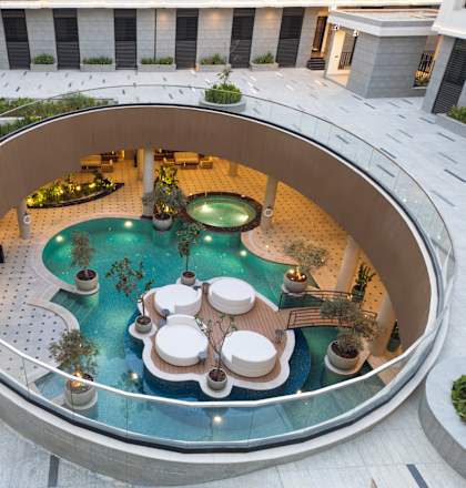 A round pool surrounded by a glass wall.