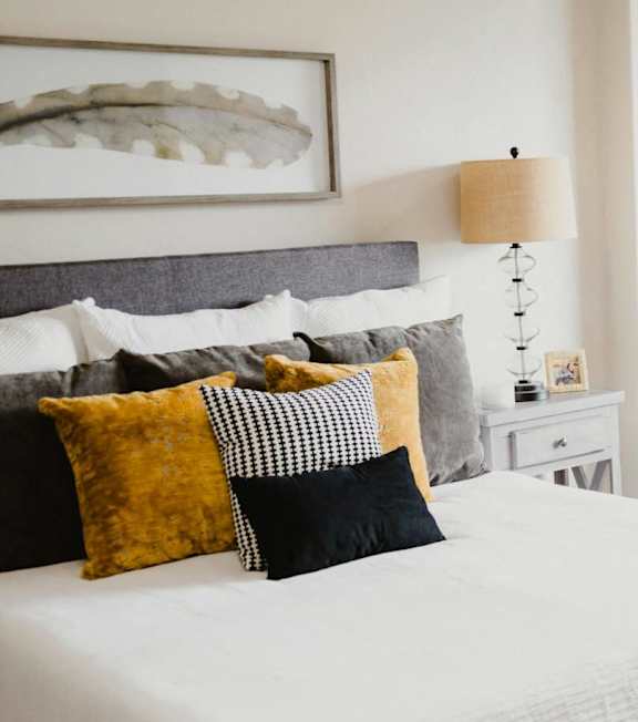 a bedroom with a bed and a sliding glass door