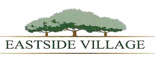 A logo with a tree and the words Eastside Village.