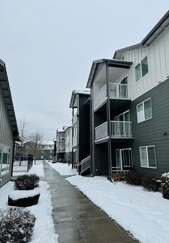 a playground in front of an apartment building at FALLS CREEK APARTMENTS, Coeur DAlene, Idaho
