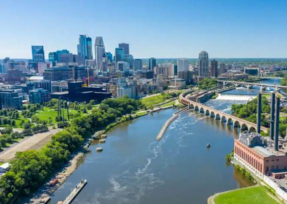 A cityscape with a river running through it.