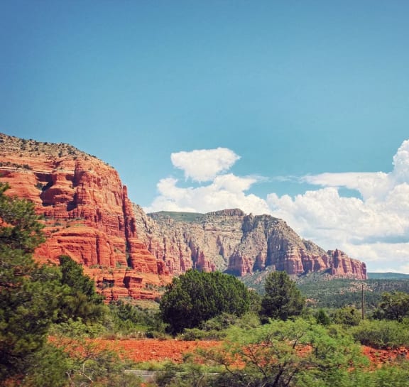 the view of the red rocks from the road
