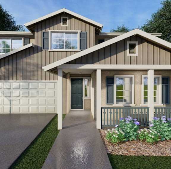 A modern house with a grey garage door and a green door.