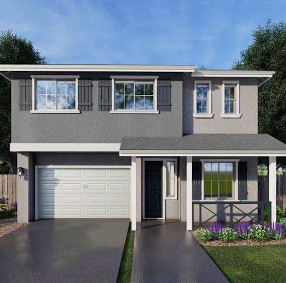 A modern house with a grey exterior and a white garage door.