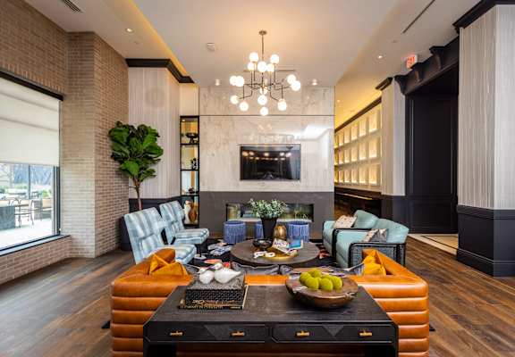 a living room filled with furniture and a large window