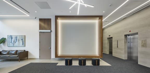 an artist's impression of the lounge and kitchen area of the new building
