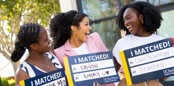 Three women holding signs that say "I MATCHED!" in various locations.