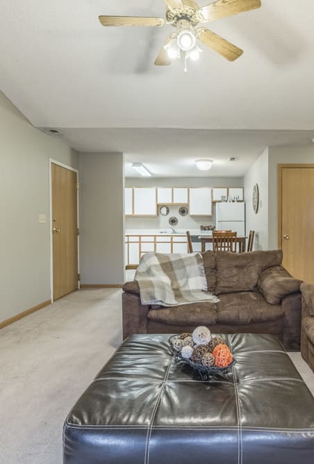a living room with couches and a coffee table