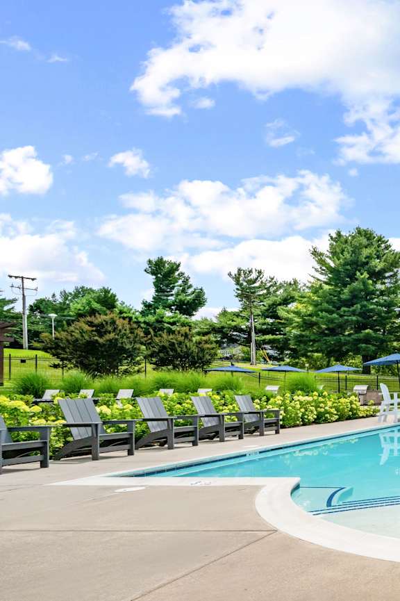 the swimming pool at the residence at dusk at DonCaster Village Apartments, Parkville, MD, 21234