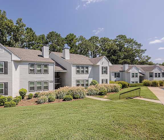 A large house with a grey roof and a green lawn in front at The Vistas, Macon, Georgia, 31210