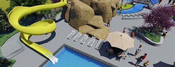 A bird's eye view of a resort with a large pool and a water slide.