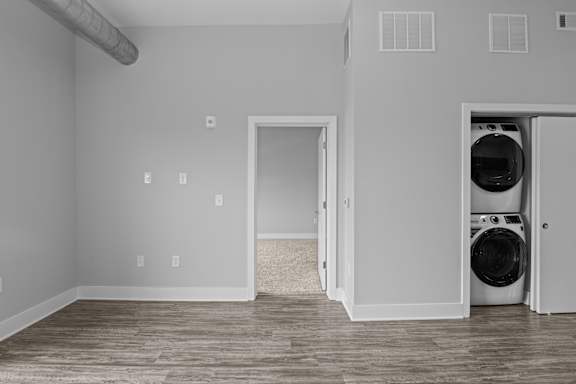 A laundry room with a washer and dryer in it.