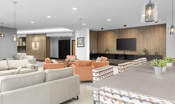 a living room with couches and chairs and a table