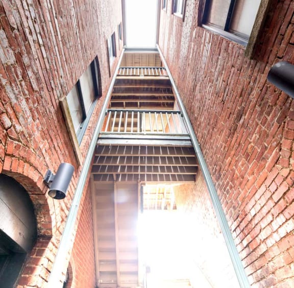 Brick building exterior and stairwell at Lockerbie Court on Mass Ave, Indianapolis, IN