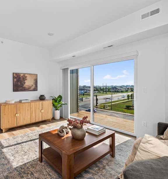 A modern kitchen with wooden floors and a large island.