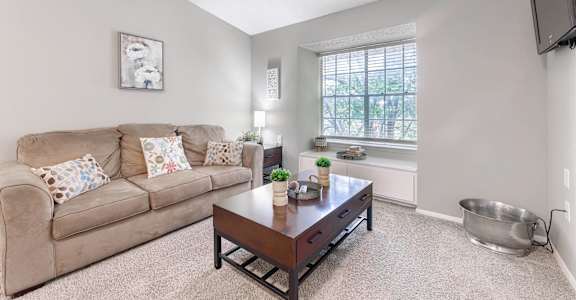 a living room with a couch and a coffee table