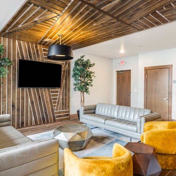 a living room with a pool table and a tv at Northern Lights a Lifestyle-Driven Community, West Fargo, ND