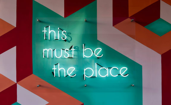 this must be the place neon sign at Telka Apartments, Silverdale, WA