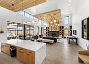 Thumbnail 23 of 32 - A modern kitchen with a large island and wooden ceiling at Alante Homes at Spring Run, Caldwell, Idaho