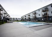 Thumbnail 8 of 8 - a pool is shown in the courtyard of an apartment building
