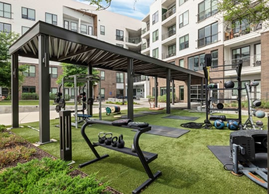 our apartments have a gym with equipment and apartments in the background