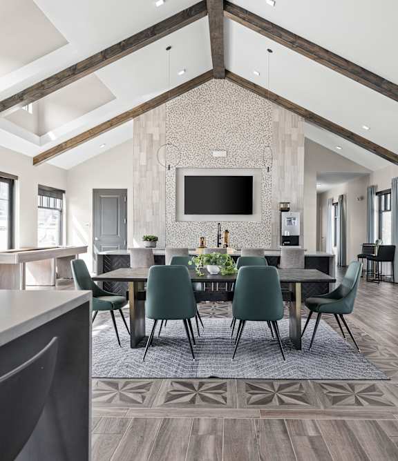 a large dining room with a large table and chairs