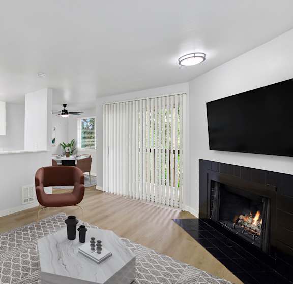 A modern living room with a fireplace and a television.