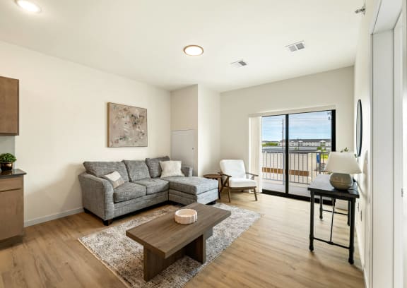 a living room with a couch and a coffee table at The Standard on 32nd, North Dakota, 58078
