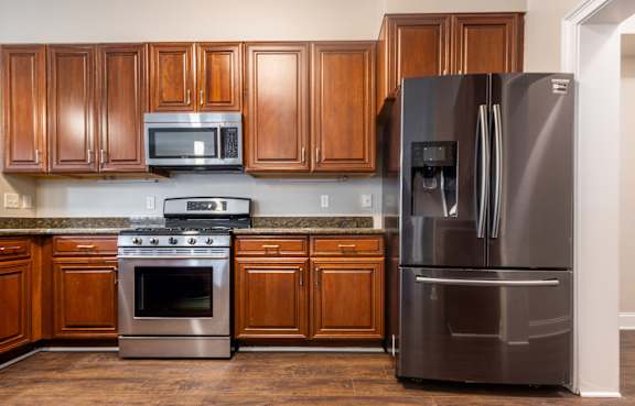 a kitchen with a counter top next to a stove top oven at Sterling Manor, Virginia