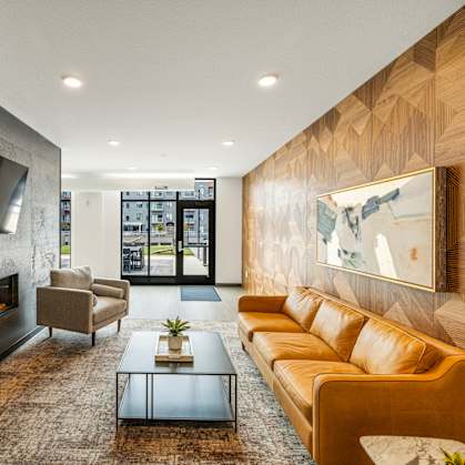 a living room with couches and a coffee table and a fireplace at EagleRidge Plaza Residences, Fargo, ND, 58104