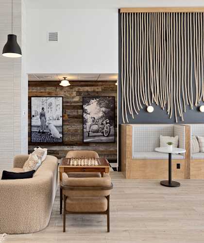 a living room with a fireplace and a black and white checkered rug at The Expo, Billings, Montana