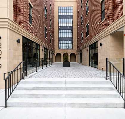 the entrance to a building with stairs in front of it