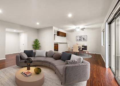 A living room with a grey sofa and a coffee table.