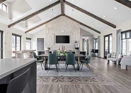a large dining room with a large table and chairs