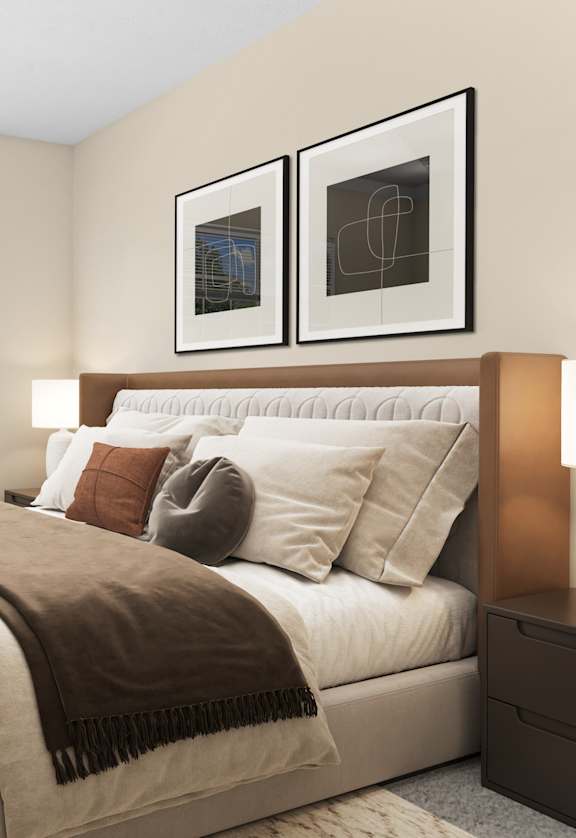 A bedroom with a large bed and a potted plant.