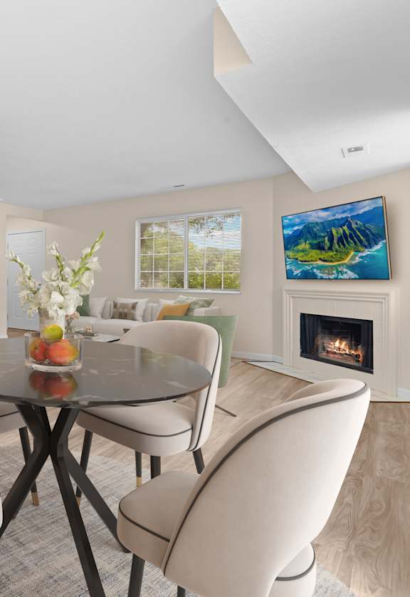 A modern kitchen with a dining table set for four.