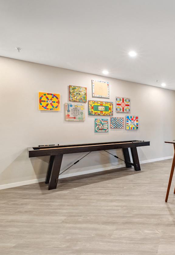 a dining room with a table and chairs and a pool table